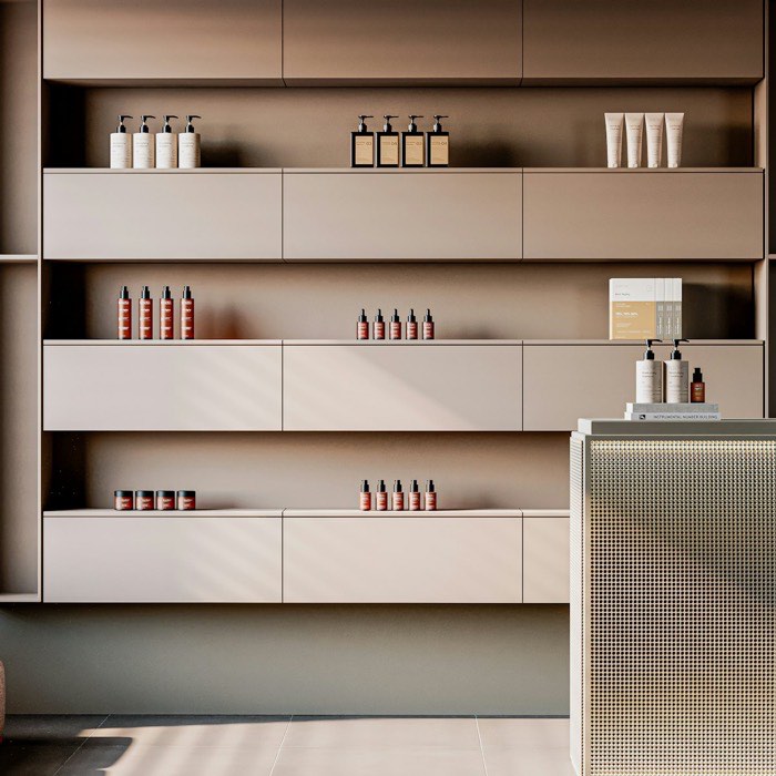 Shelves of neatly arranged hair and skincare products in the studio.